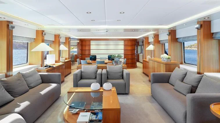a living room with a couch and a coffee table aboard ALMA Yacht for Sale