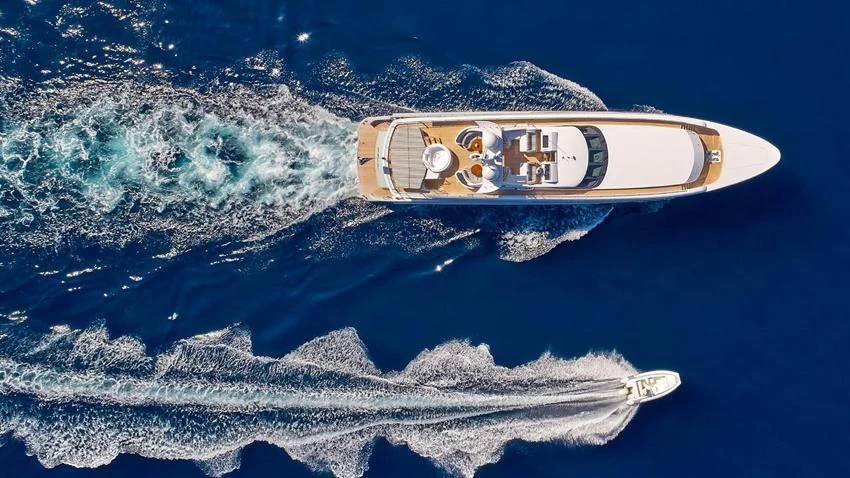 a bottle of alcohol on a floating island aboard ALMA Yacht for Sale