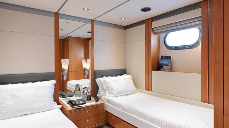 a room with two beds aboard ALMA Yacht for Sale