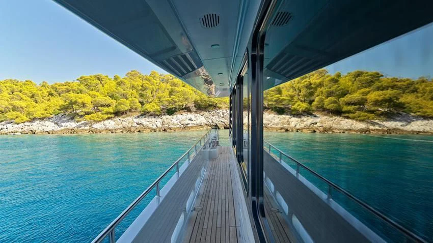 a wooden walkway over water aboard ALMA Yacht for Sale