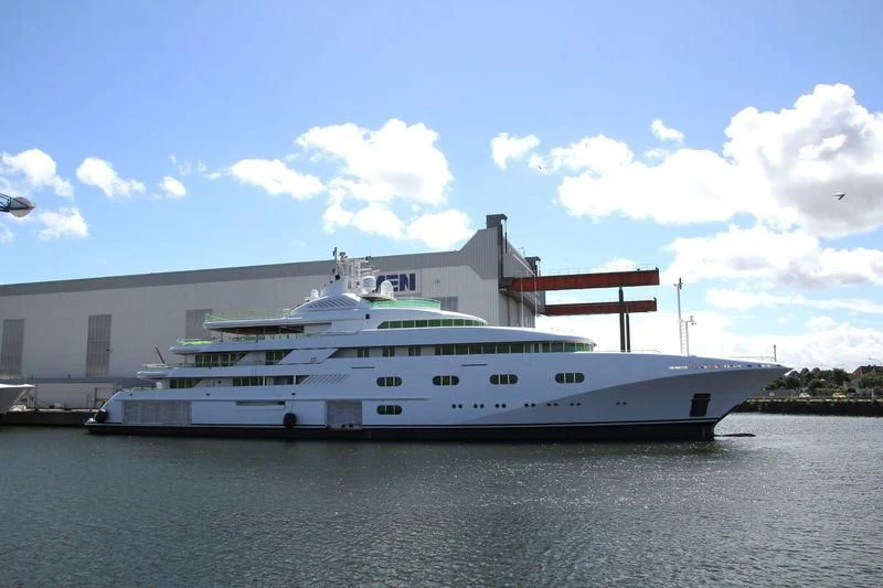 a large white yacht in front of a building aboard PEGASUS VIII Yacht for Sale