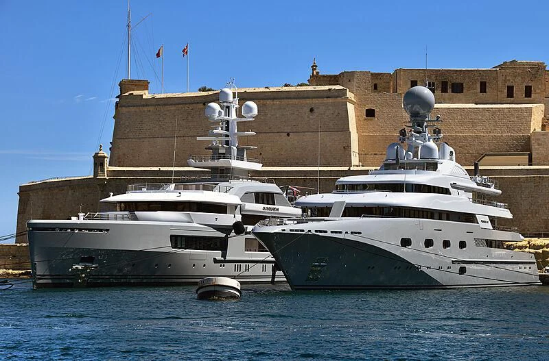 a couple of large boats in the water aboard PEGASUS VIII Yacht for Sale