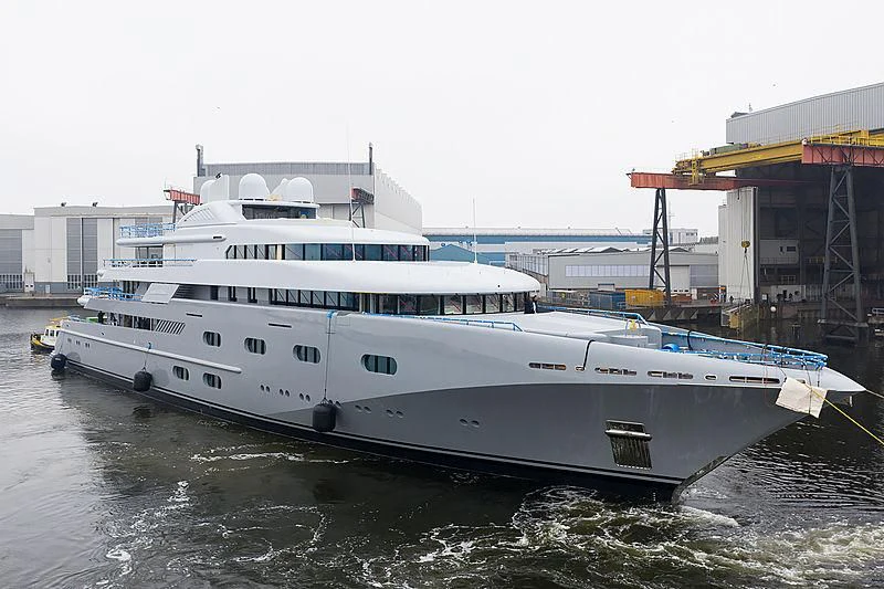 a large white boat in a harbor aboard PEGASUS VIII Yacht for Sale