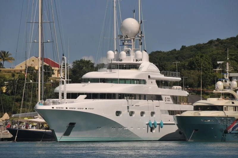 a large white boat with a large white ship in the water aboard PEGASUS VIII Yacht for Sale