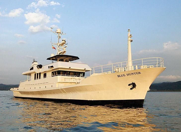 a large white ship in the water aboard DR. NO Yacht for Sale