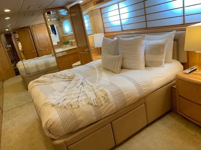 a bed in a room aboard LONE STAR Yacht for Sale