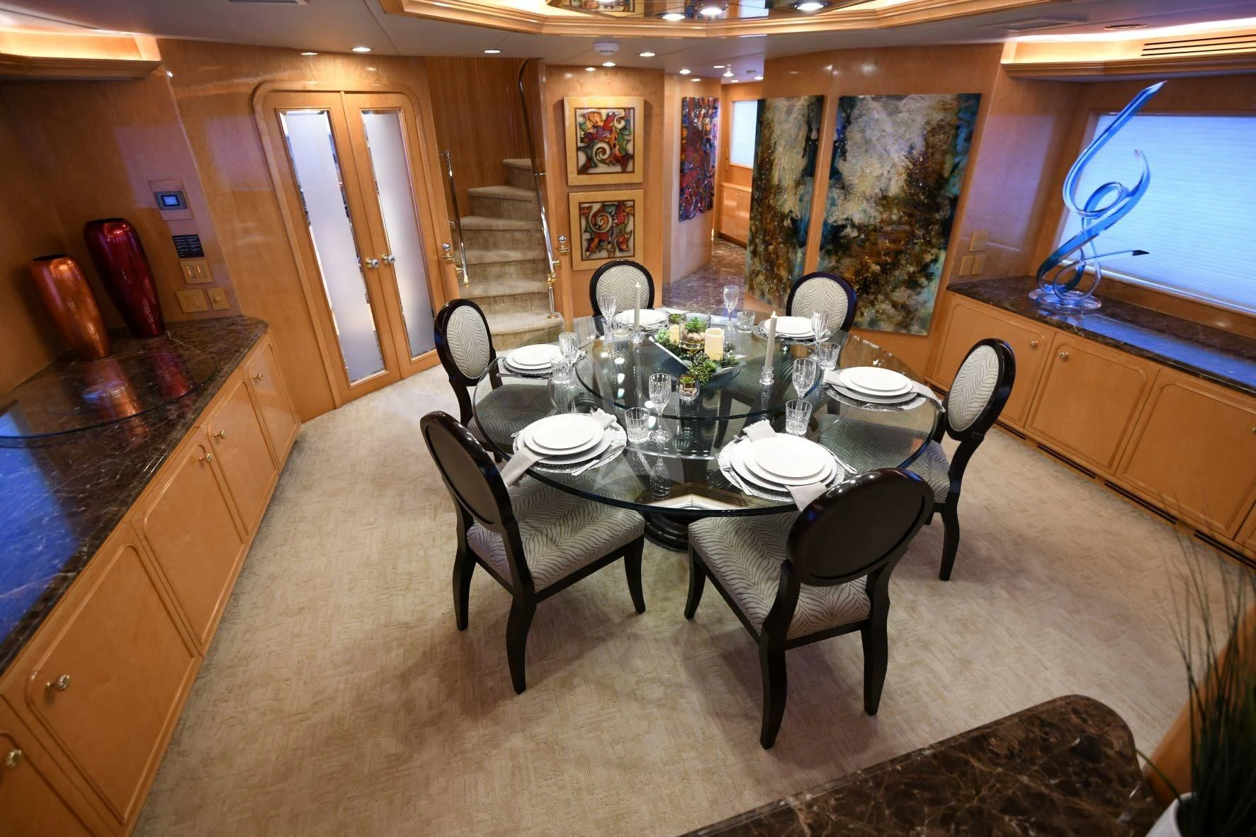 a dining table set for a dinner party aboard LONE STAR Yacht for Sale