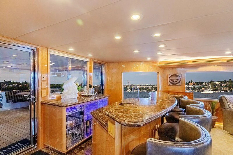 a room with a table and chairs aboard LONE STAR Yacht for Sale