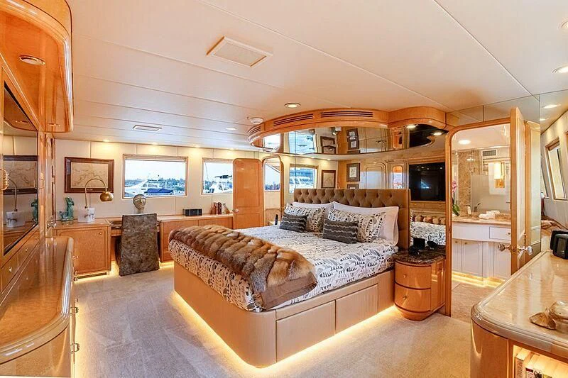 a large bedroom with a large bed aboard LONE STAR Yacht for Sale