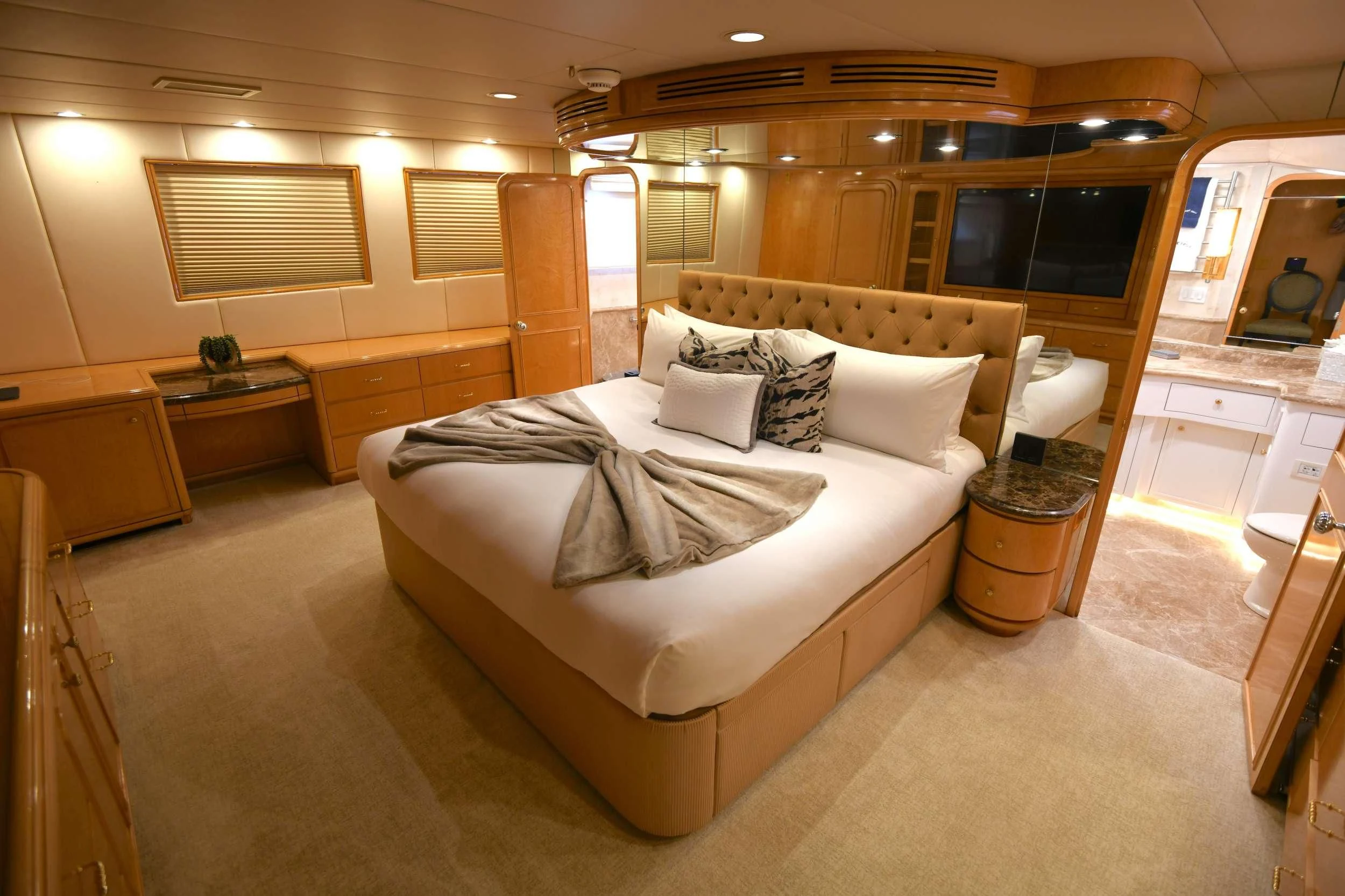 a large bed in a room aboard LONE STAR Yacht for Sale