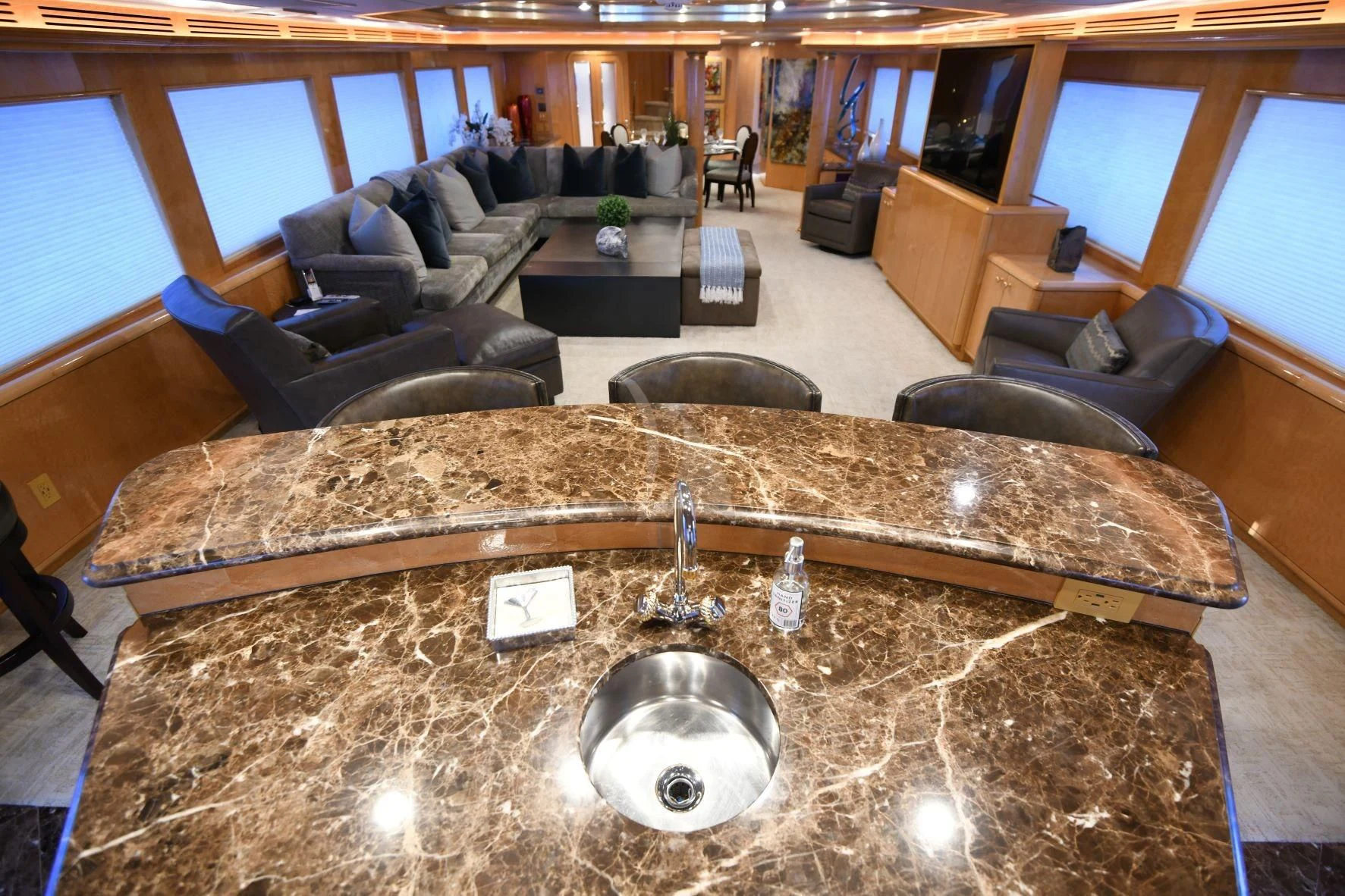 a large room with a large round table and a large round object aboard LONE STAR Yacht for Sale