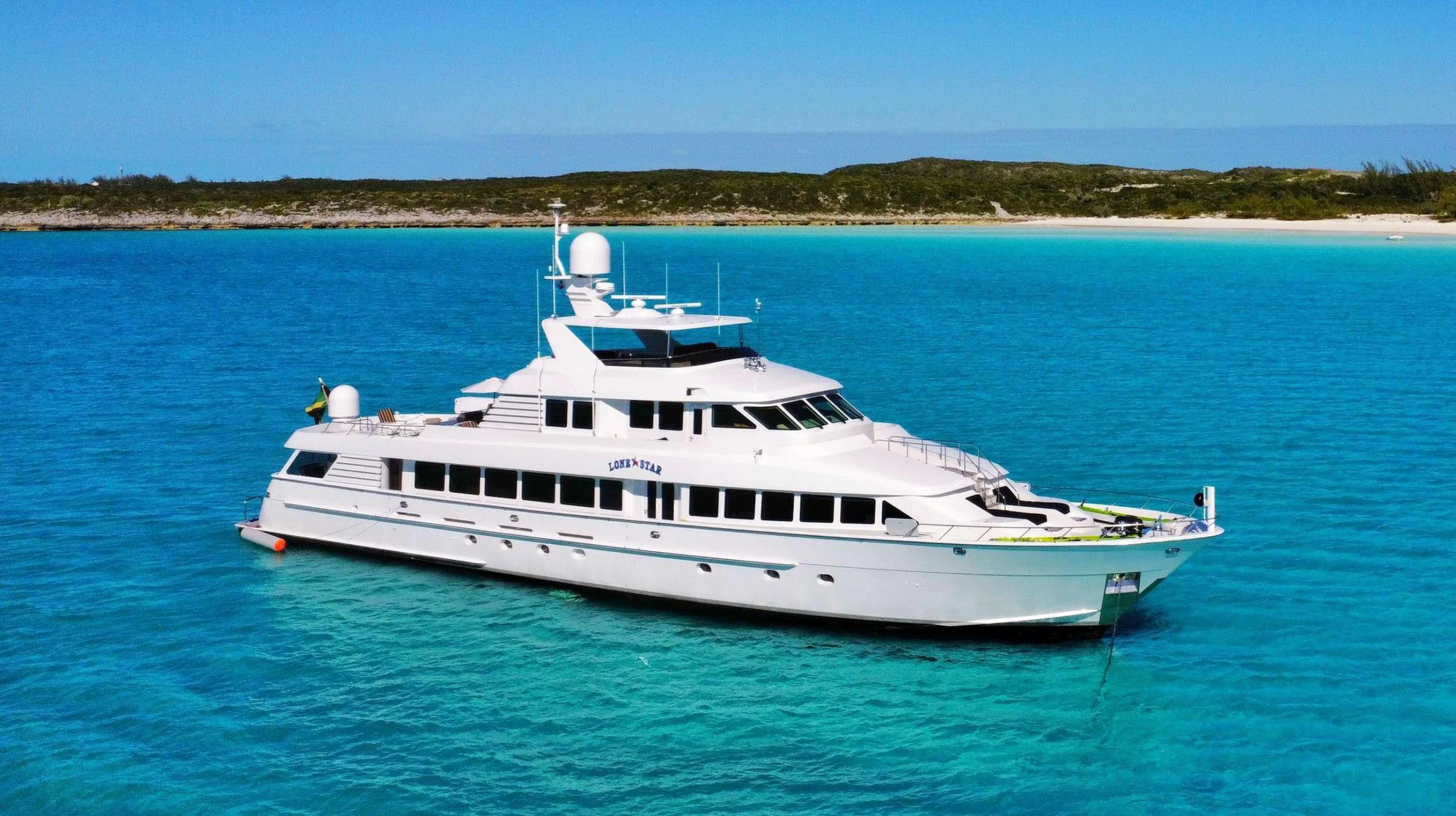 a white yacht in the water aboard LONE STAR Yacht for Sale