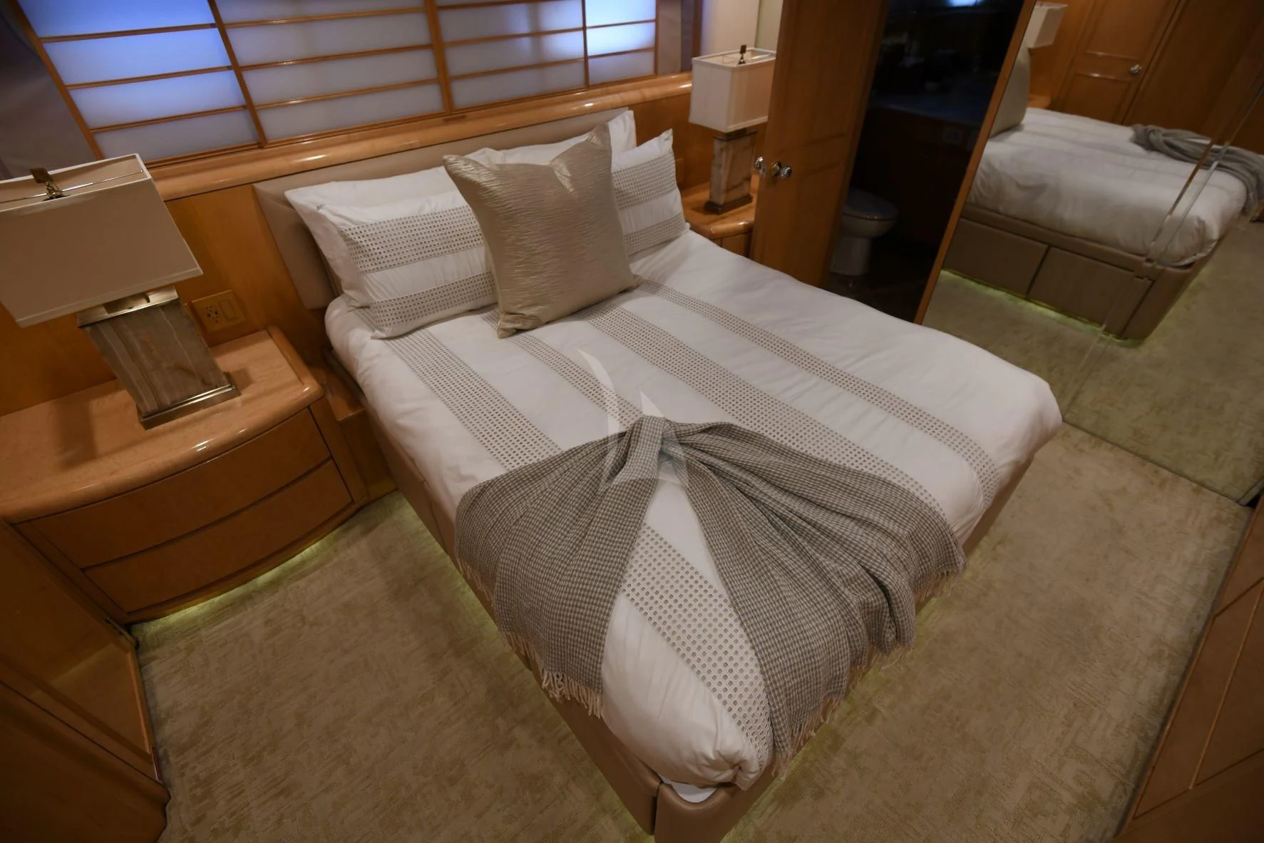 a bed with a white sheet aboard LONE STAR Yacht for Sale