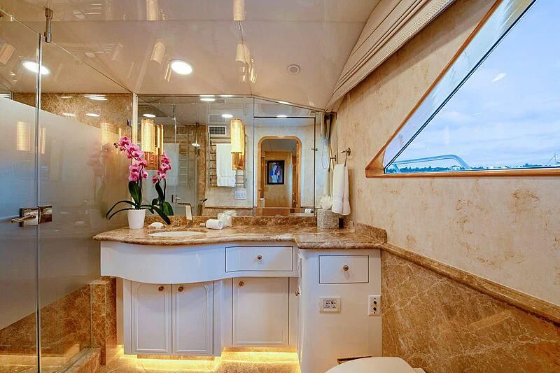 a bathroom with a sink and a mirror aboard LONE STAR Yacht for Sale