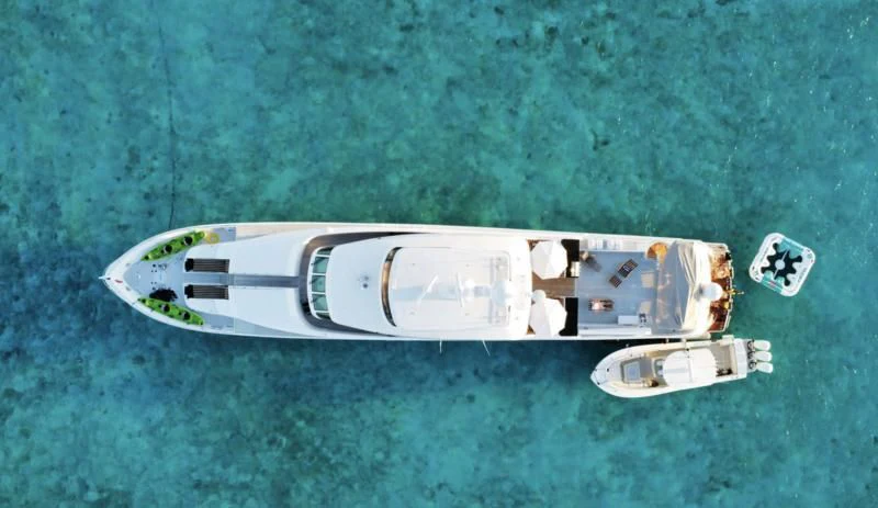 a white boat with a white stripe on the front aboard LONE STAR Yacht for Sale