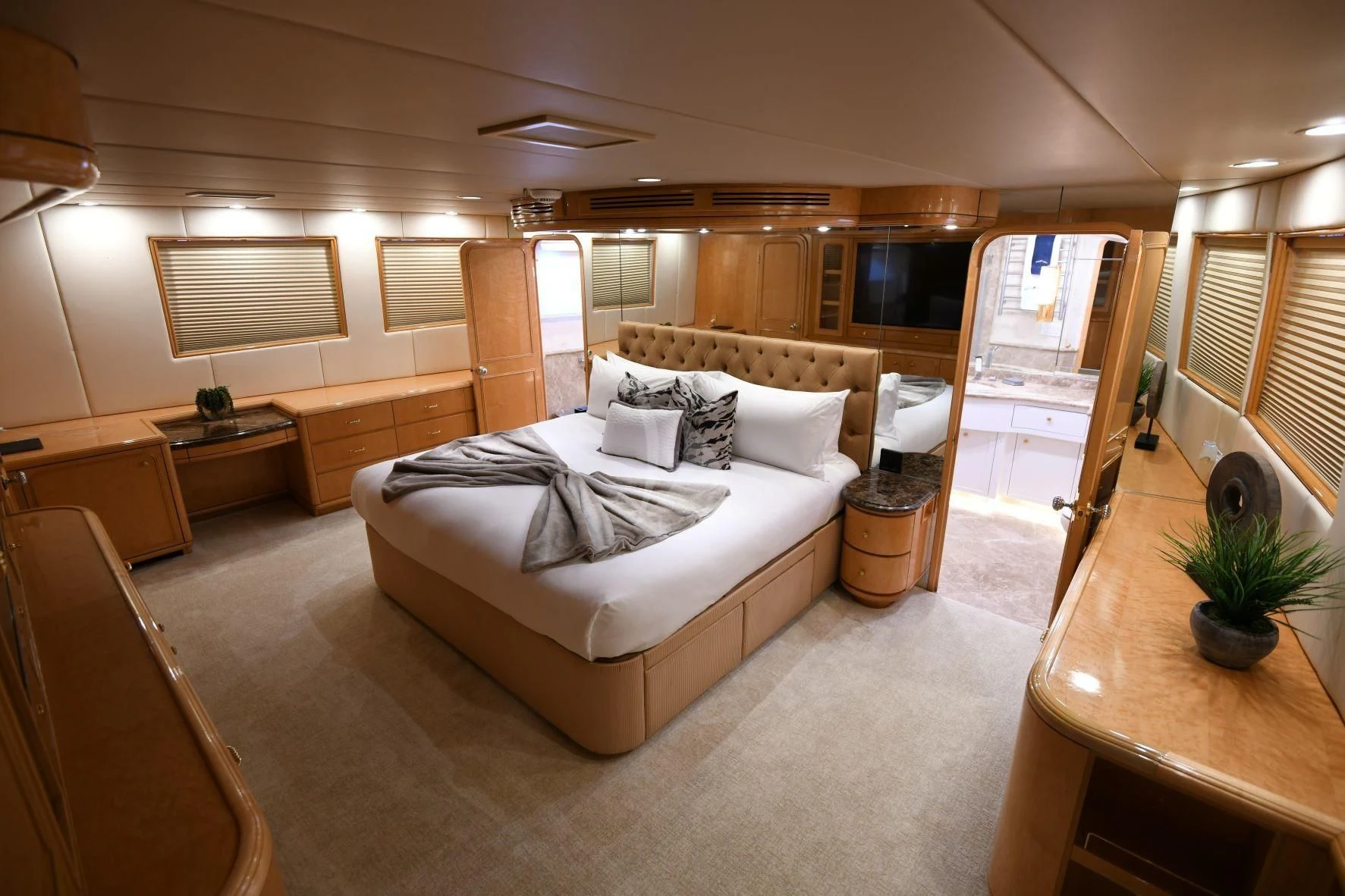 a bedroom with a large bed aboard LONE STAR Yacht for Sale