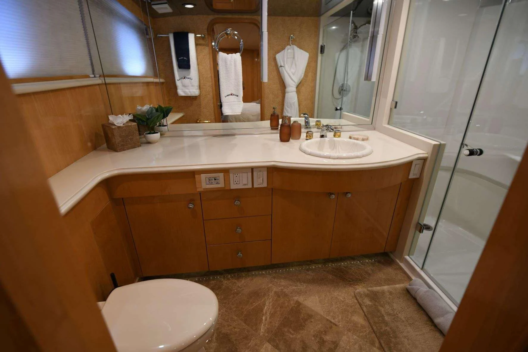 a bathroom with a large mirror aboard LONE STAR Yacht for Sale