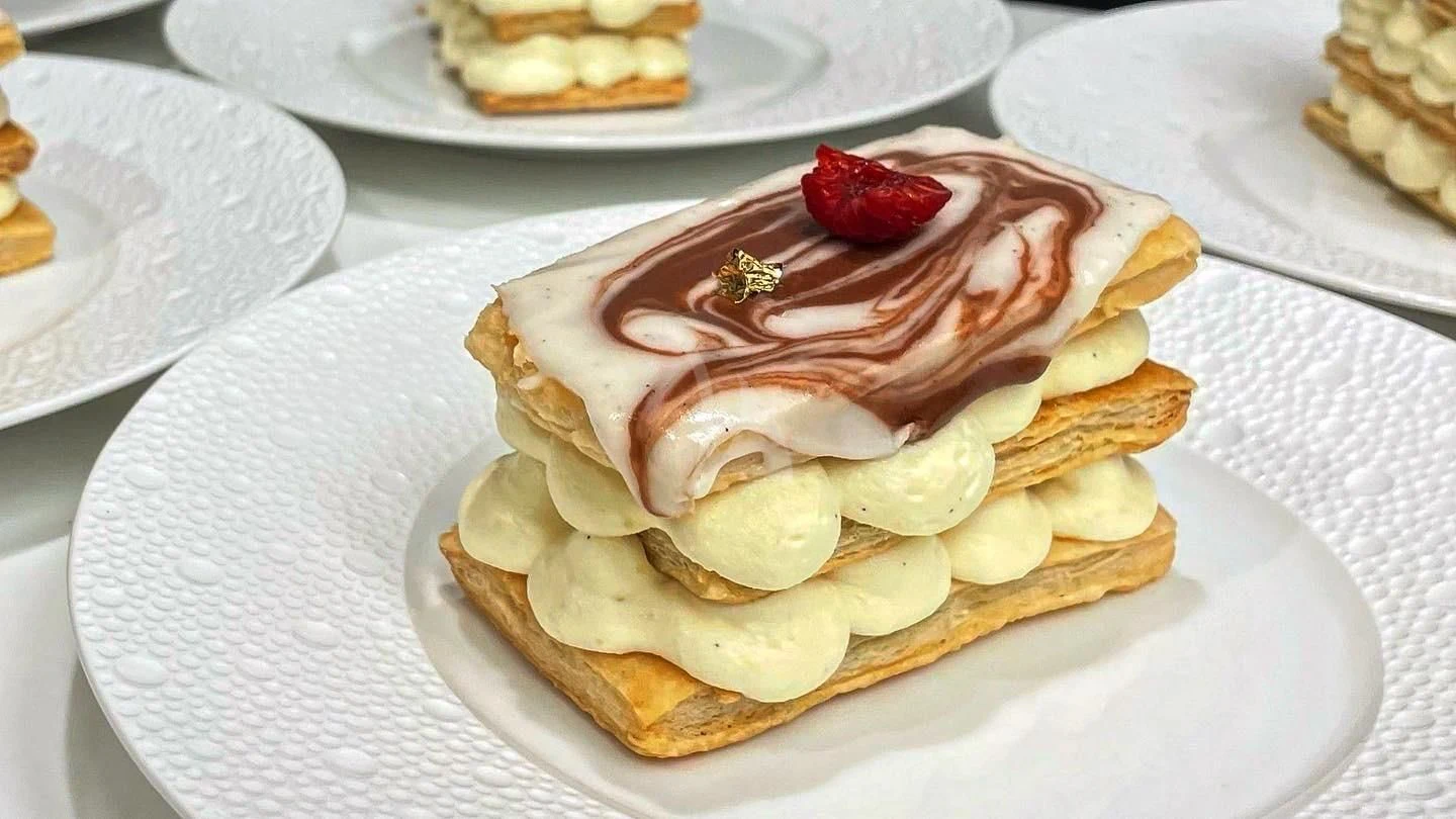 a stack of pancakes with syrup and banana slices on top aboard LONE STAR Yacht for Sale