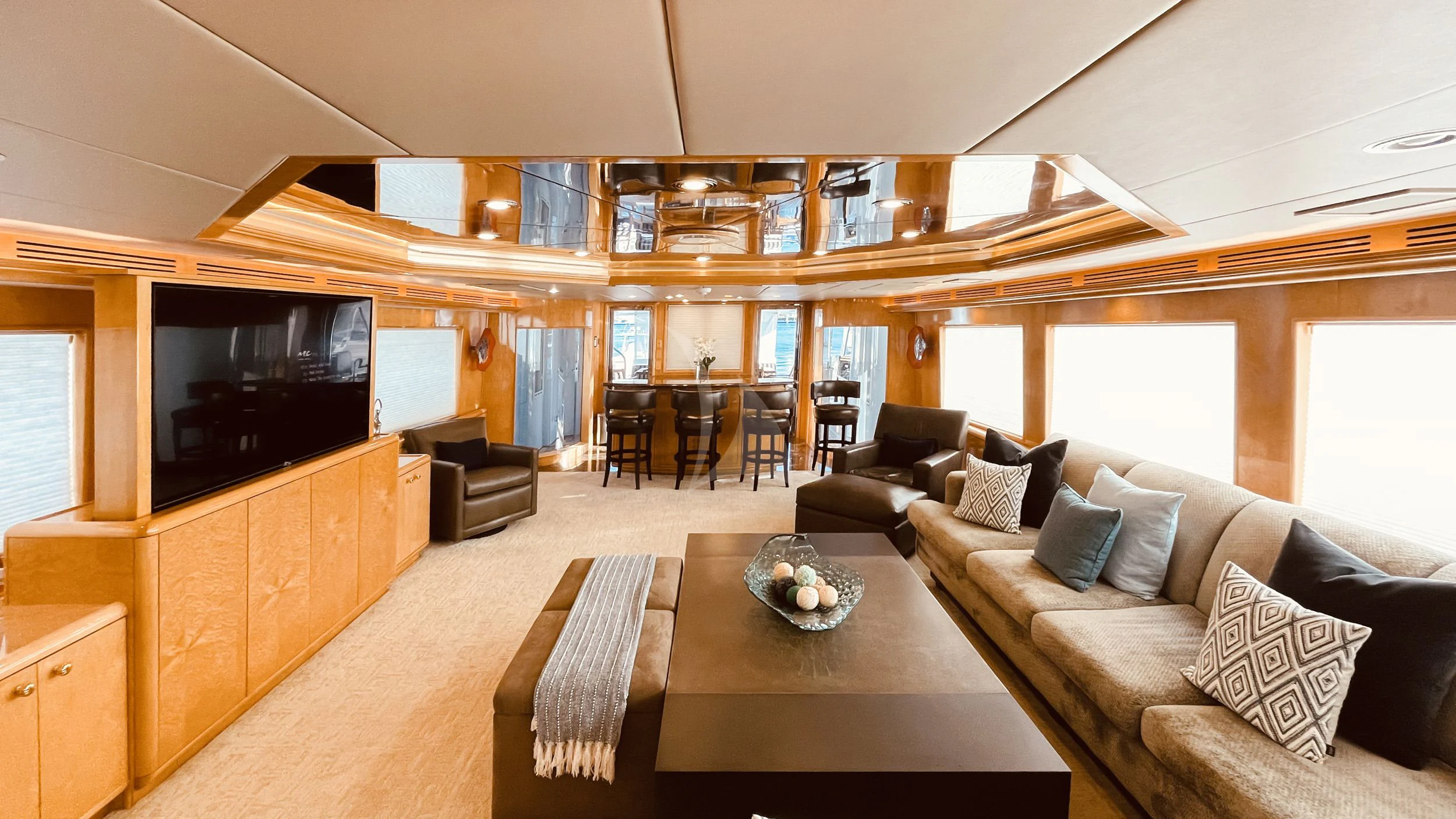 a living room with a large tv aboard LONE STAR Yacht for Sale