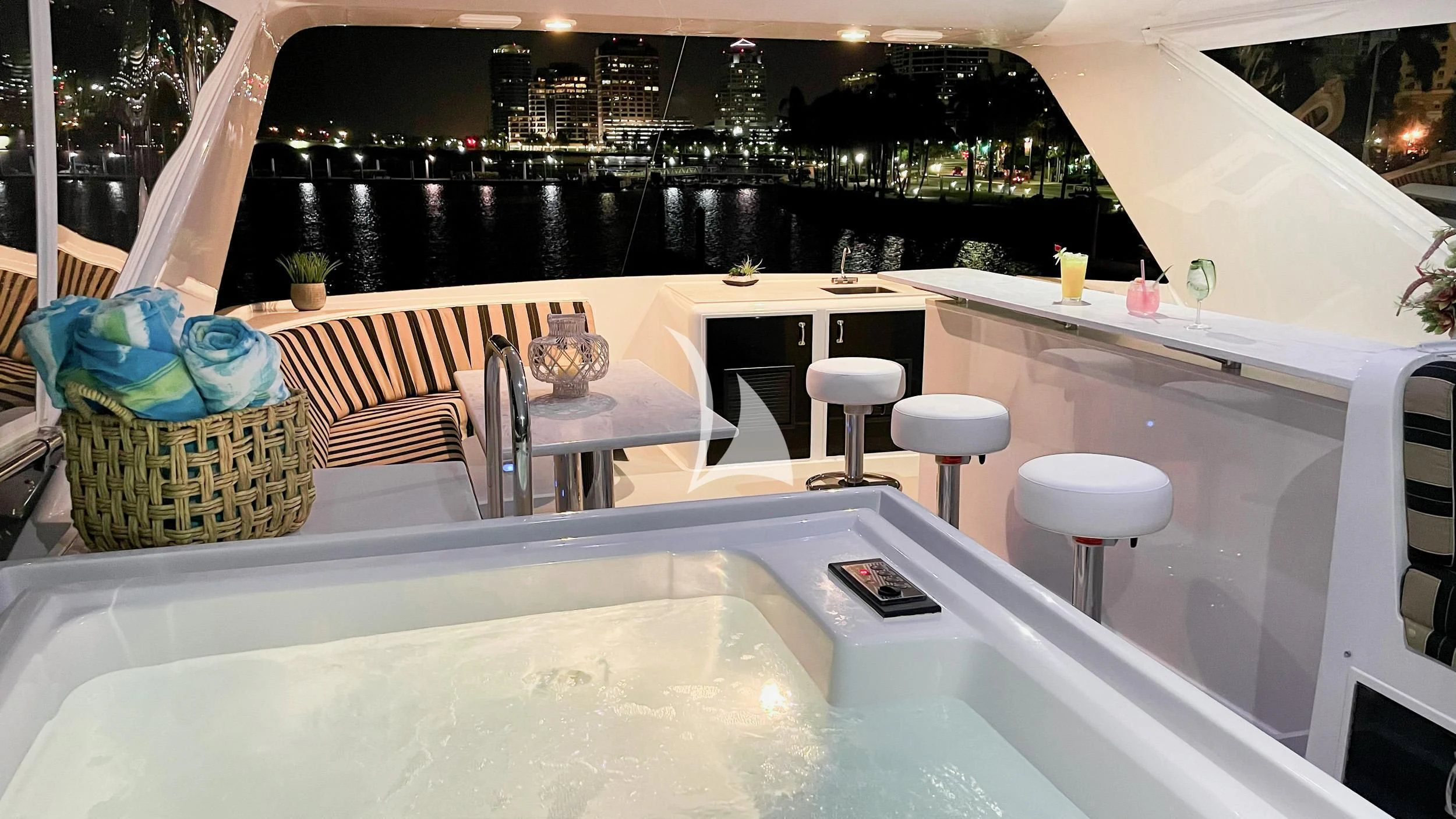 a table with chairs and a basket on it aboard LONE STAR Yacht for Sale