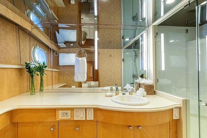 a bathroom with a large mirror aboard LONE STAR Yacht for Sale