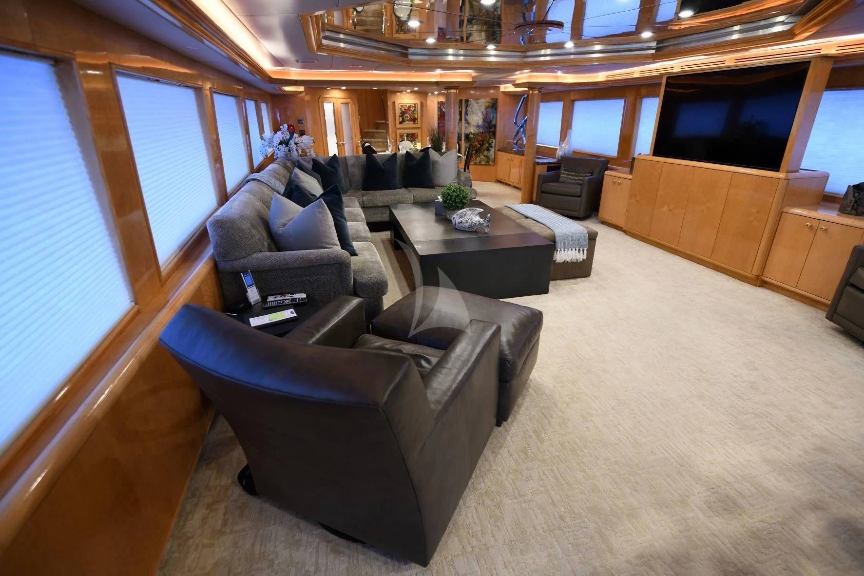 a living room with a leather couch aboard LONE STAR Yacht for Sale