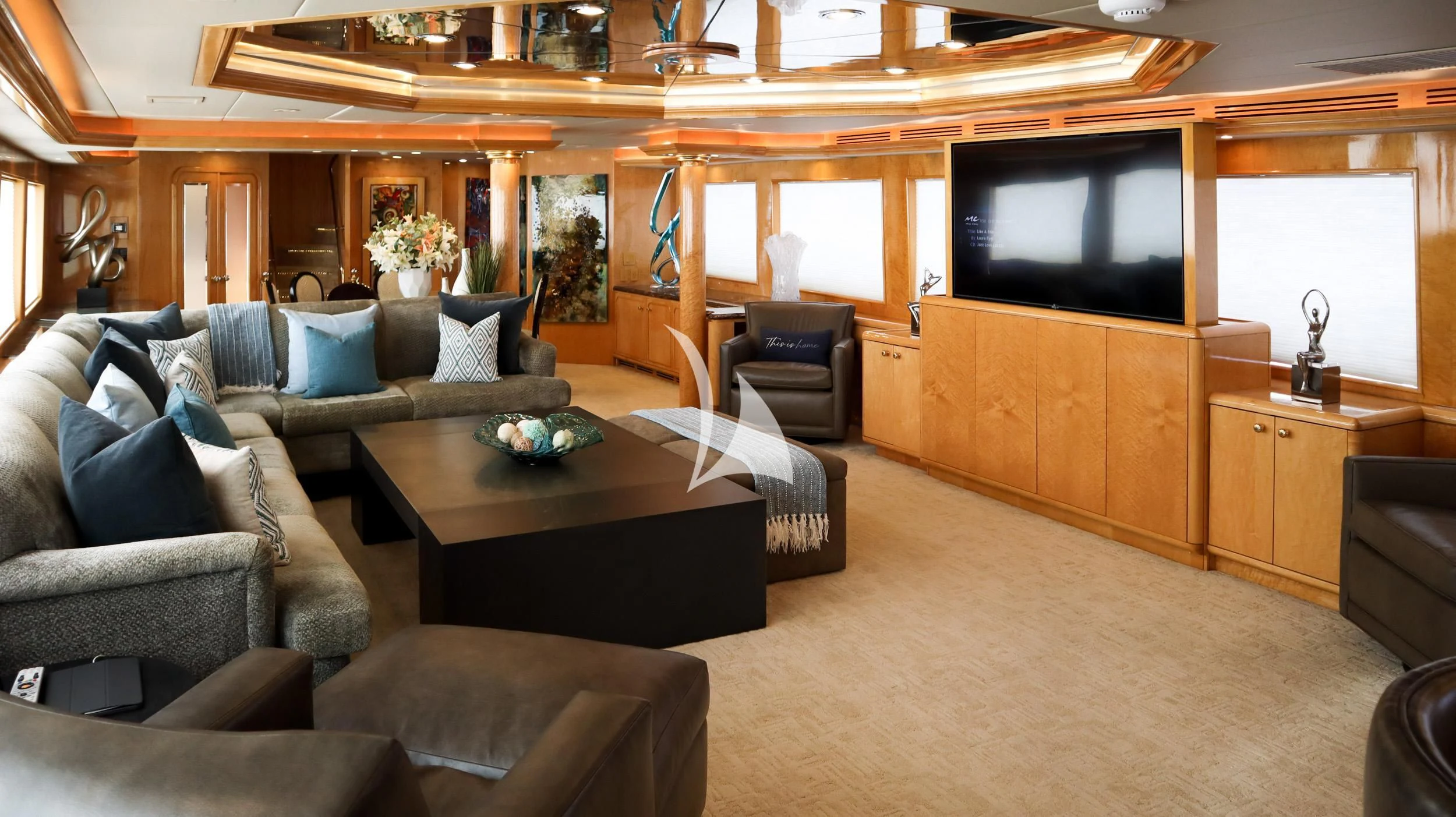 a living room with a large television aboard LONE STAR Yacht for Sale