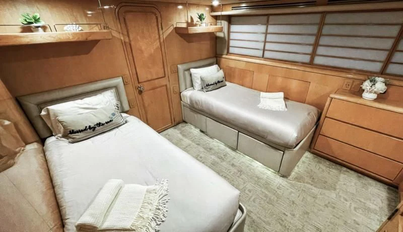 a room with a bed and a couch aboard LONE STAR Yacht for Sale
