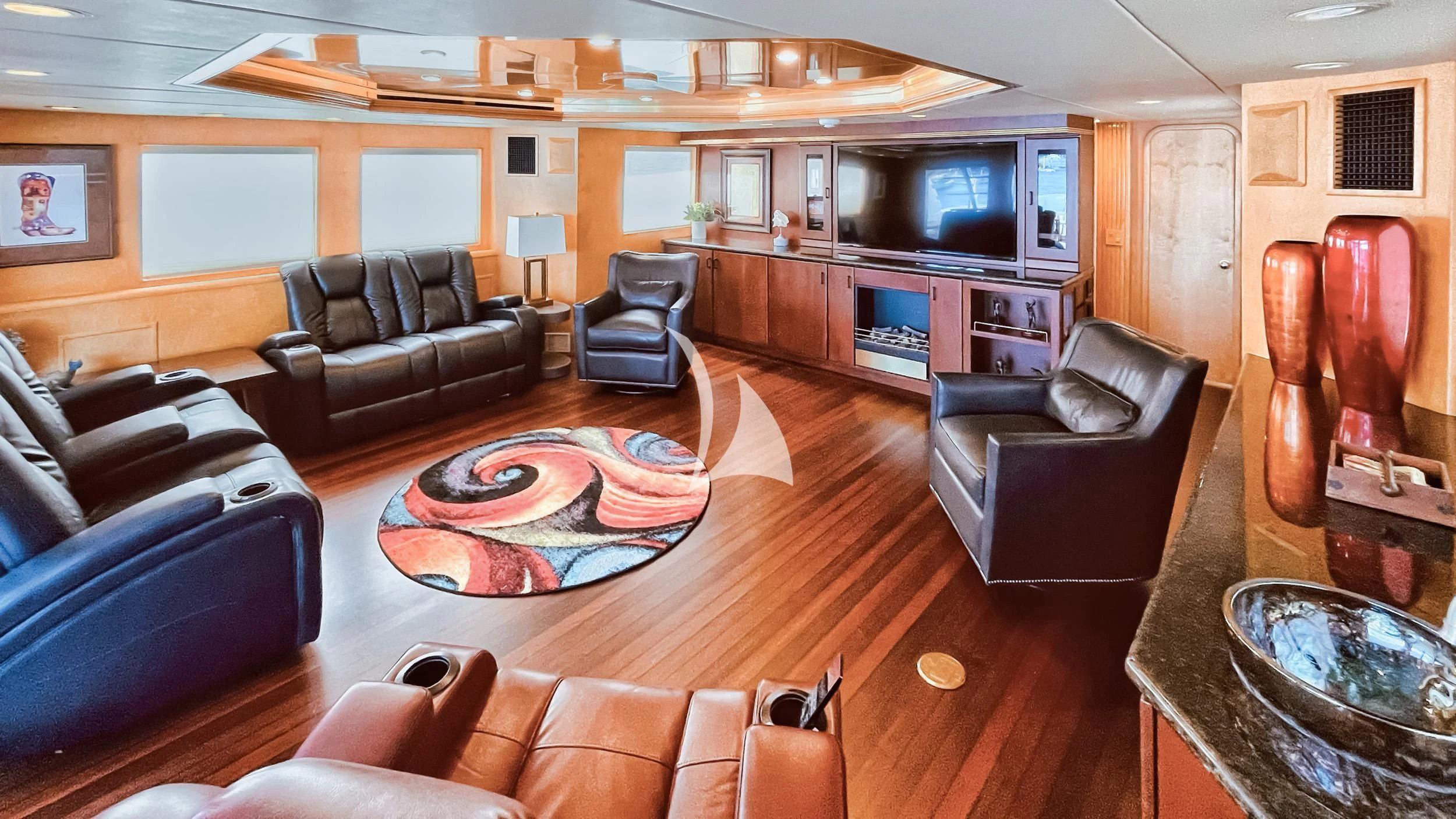 a living room with leather furniture aboard LONE STAR Yacht for Sale