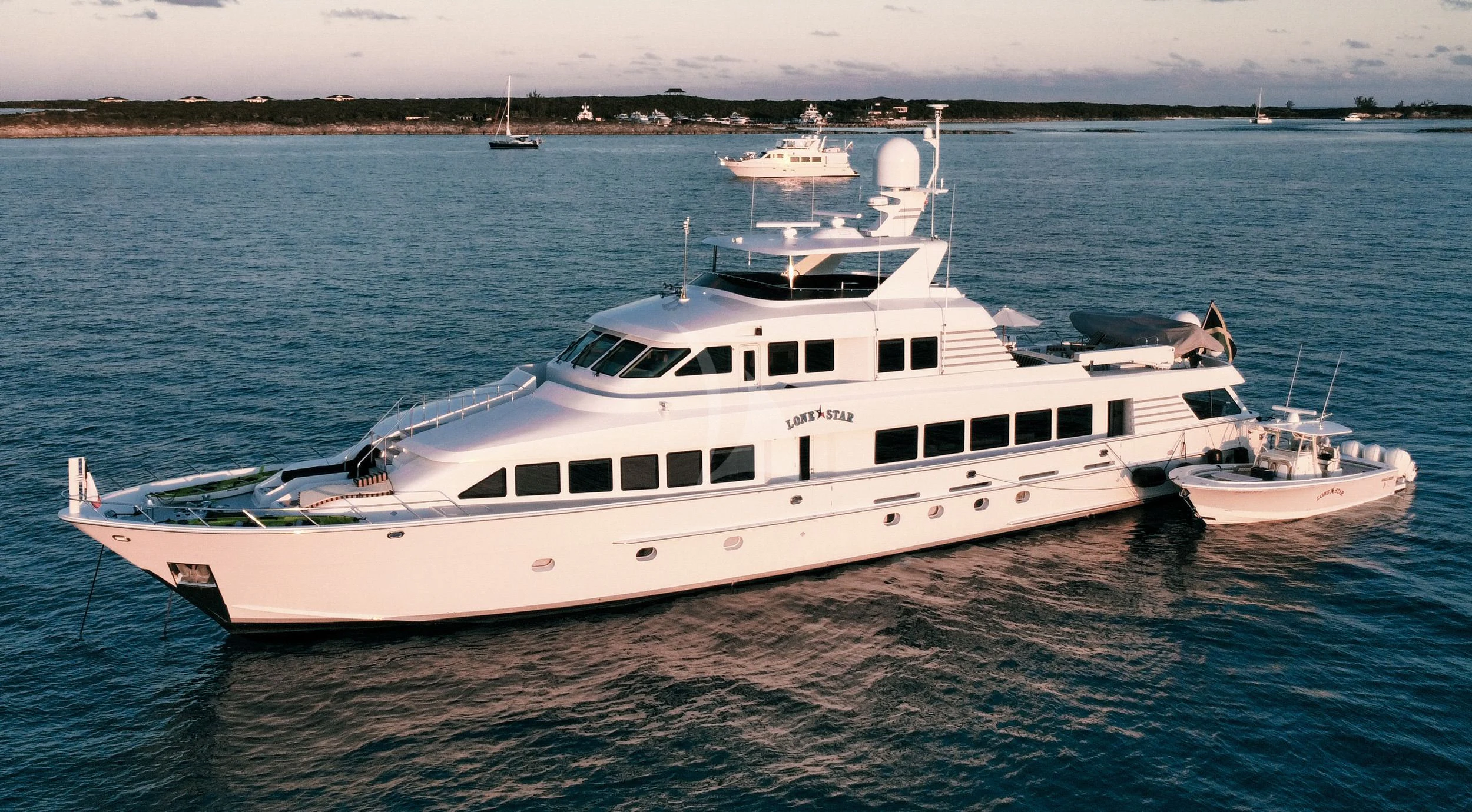a white yacht in the water aboard LONE STAR Yacht for Sale