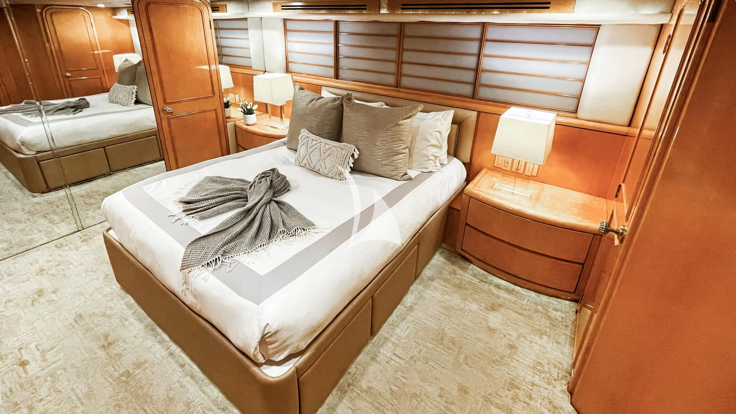 a bed with a white sheet and pillows aboard LONE STAR Yacht for Sale