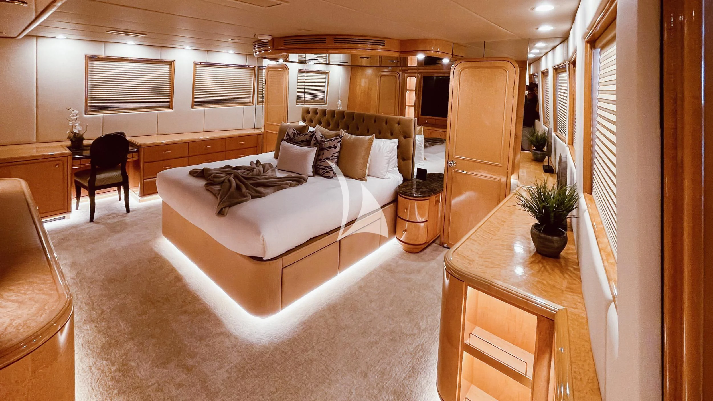a large room with a bed and a desk aboard LONE STAR Yacht for Sale
