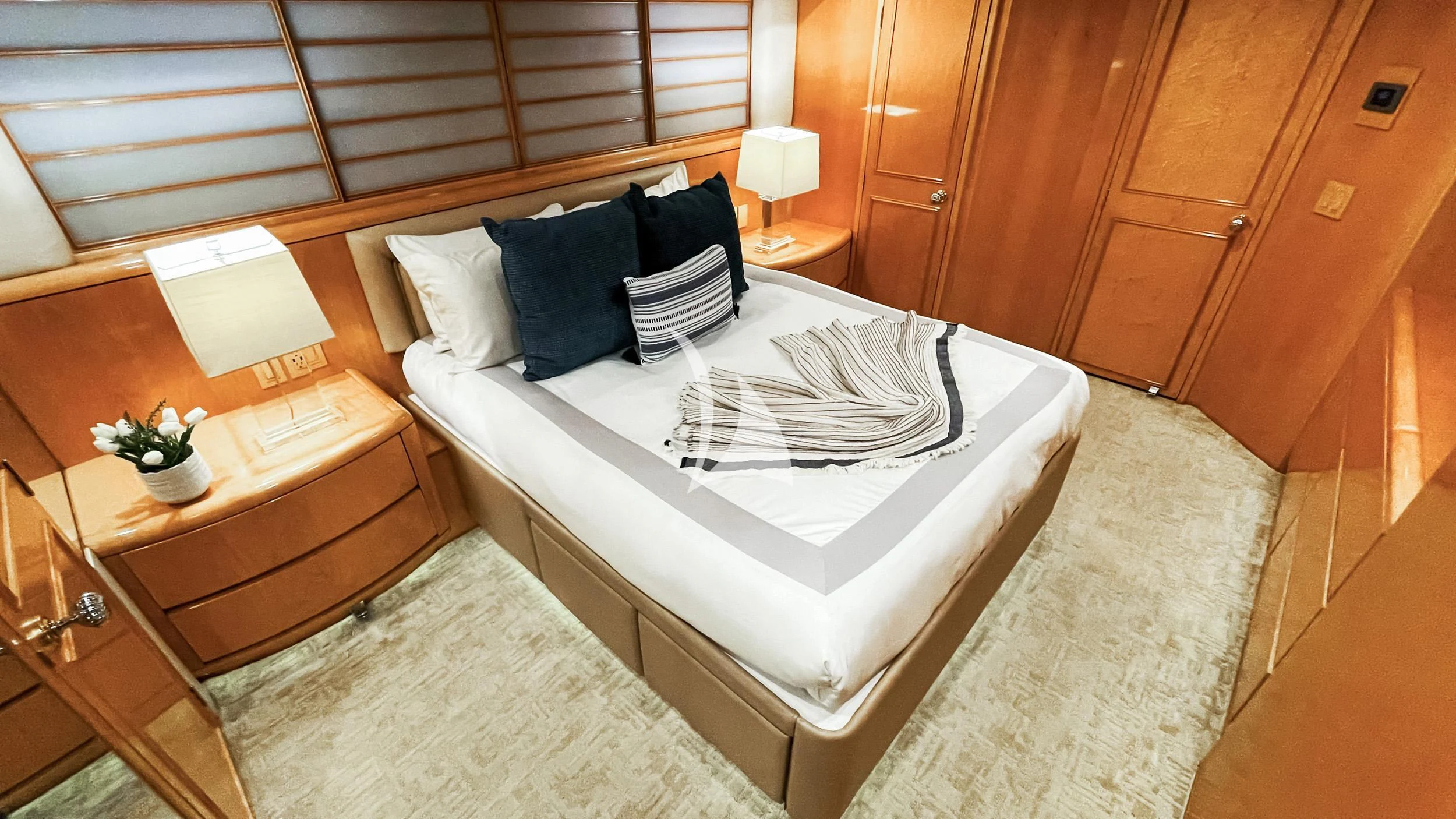 a bed with white sheets and pillows aboard LONE STAR Yacht for Sale