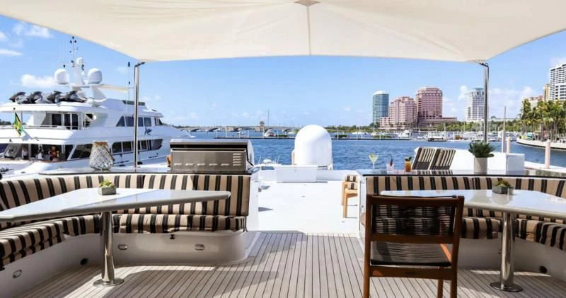 a deck with a view of a city and a body of water aboard LONE STAR Yacht for Sale