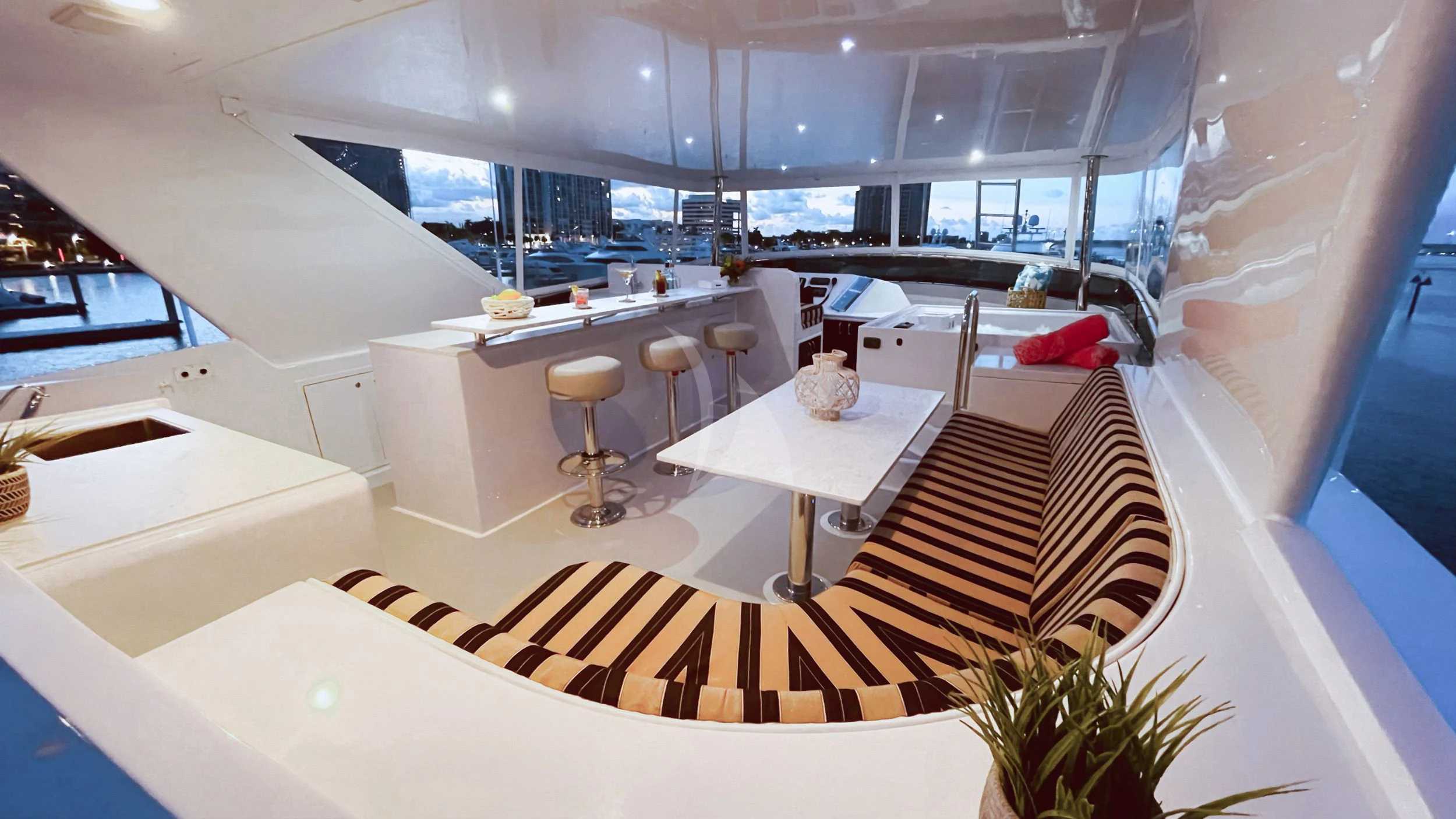 a room with tables and chairs aboard LONE STAR Yacht for Sale