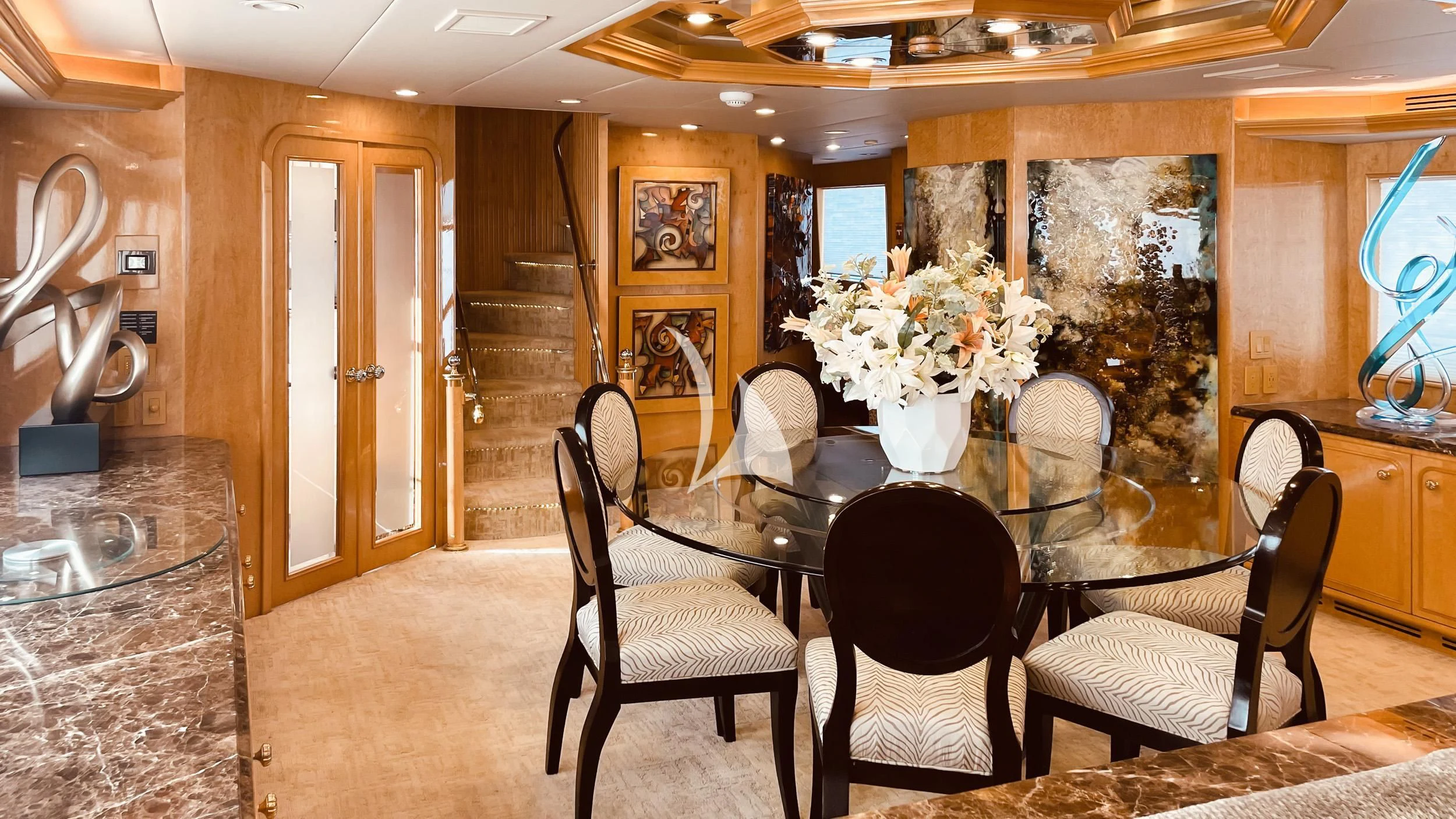 a dining room with a table and chairs aboard LONE STAR Yacht for Sale