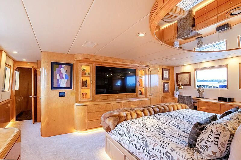 a bedroom with a large bed aboard LONE STAR Yacht for Sale