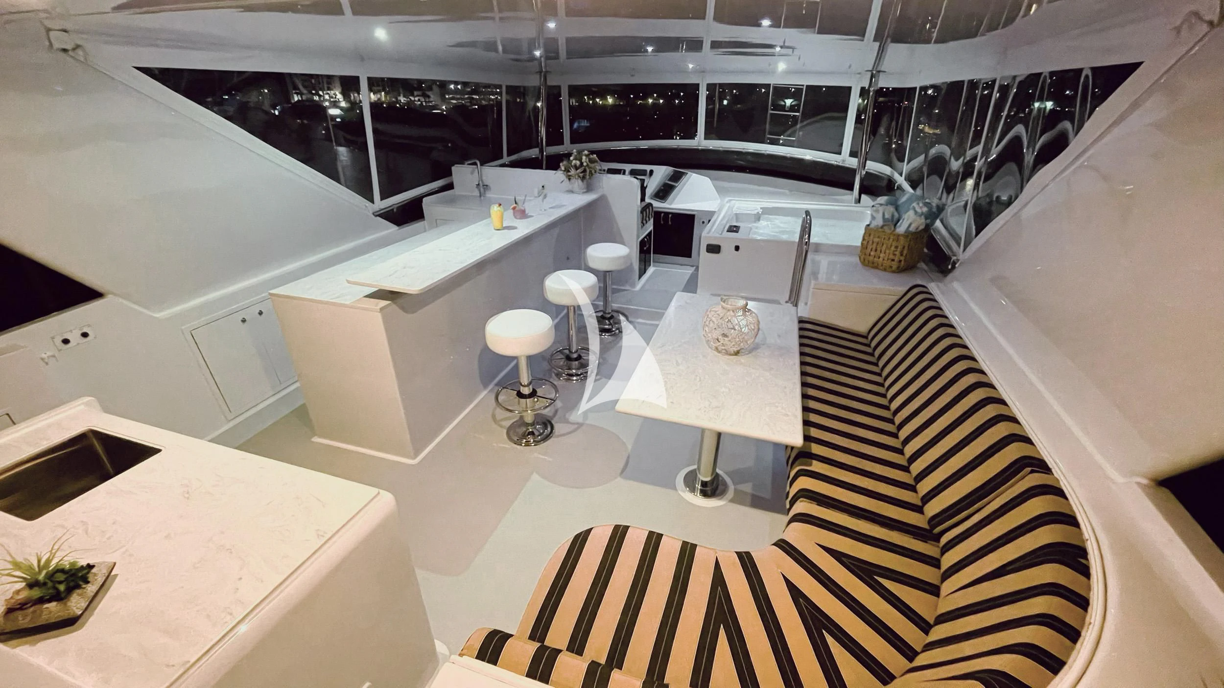 a room with white tables and chairs aboard LONE STAR Yacht for Sale