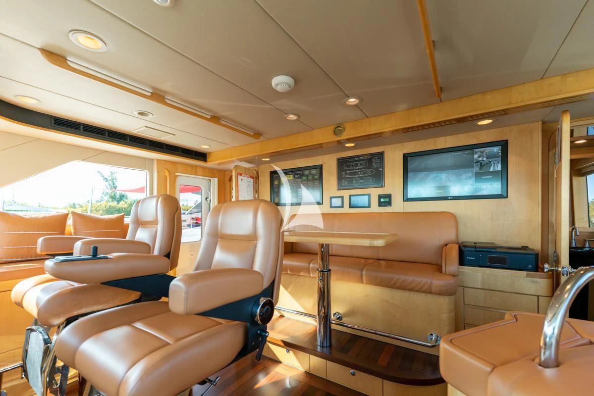 a room with a couch and chairs aboard LONE STAR Yacht for Sale
