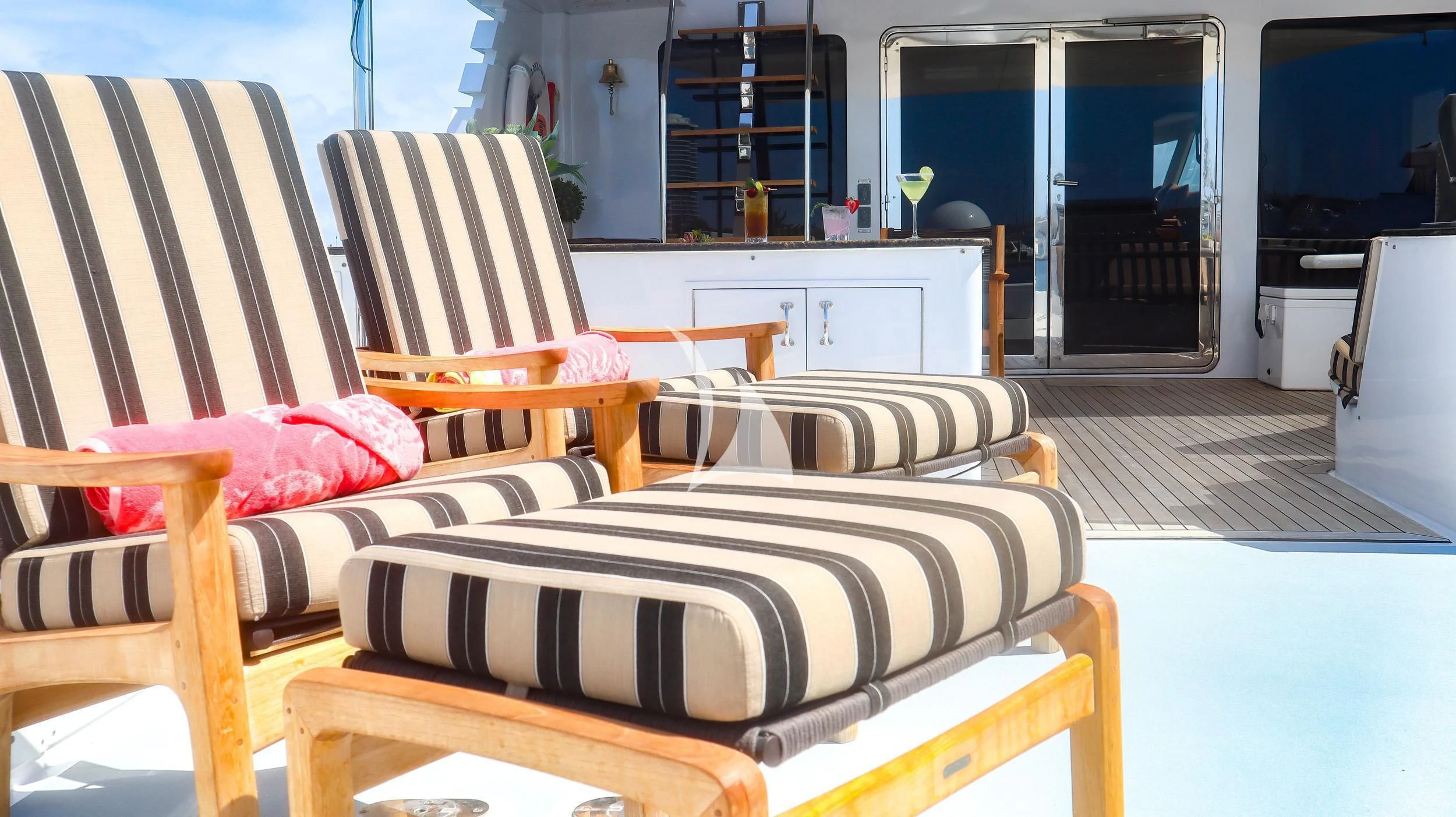 a room with couches and chairs aboard LONE STAR Yacht for Sale