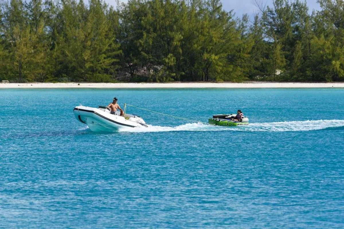 a couple of people on a speed boat in the water aboard LONE STAR Yacht for Sale