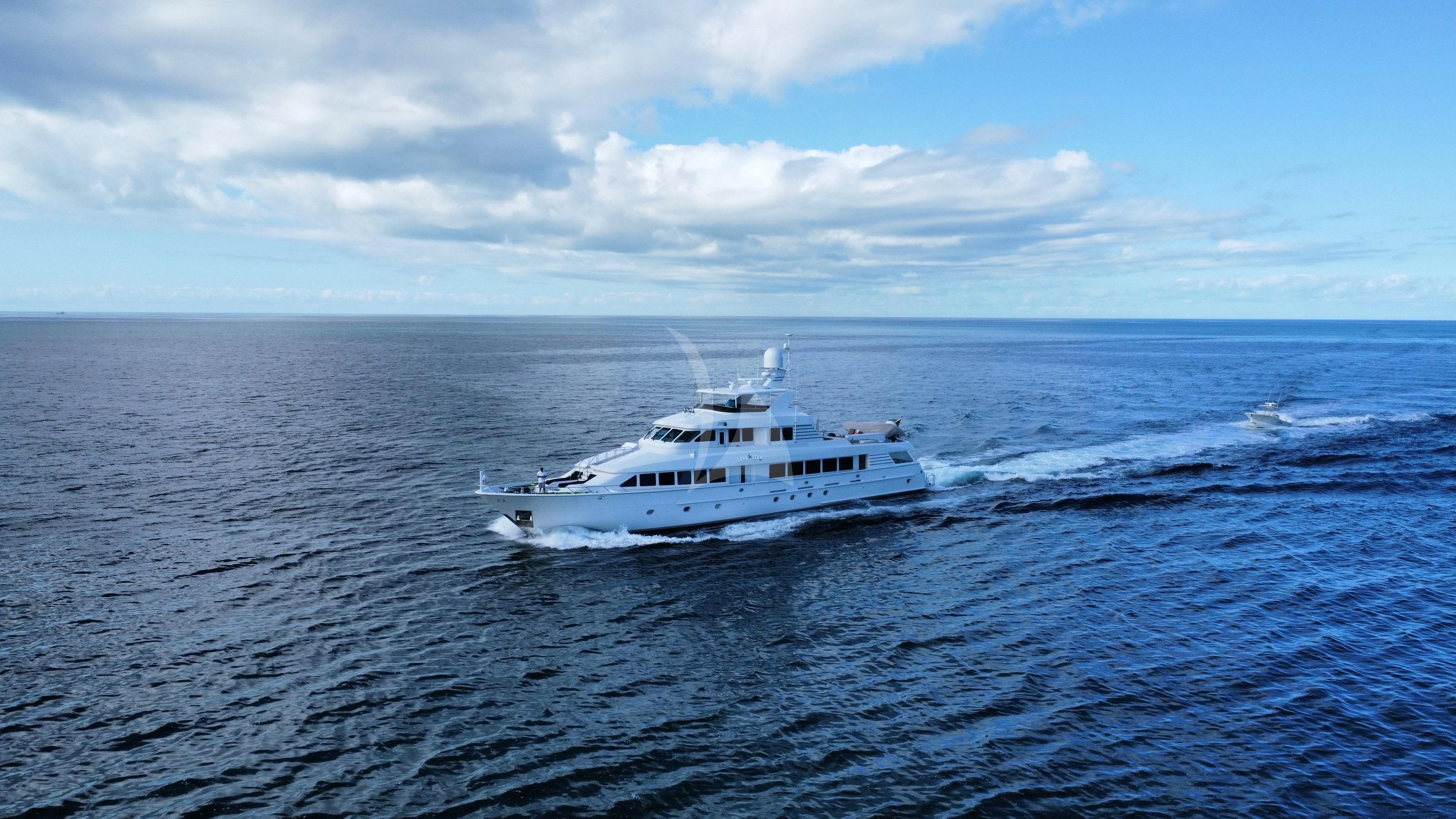 a white boat in the water aboard LONE STAR Yacht for Sale
