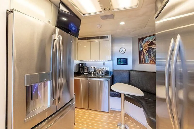 a kitchen with a stainless steel refrigerator aboard LONE STAR Yacht for Sale