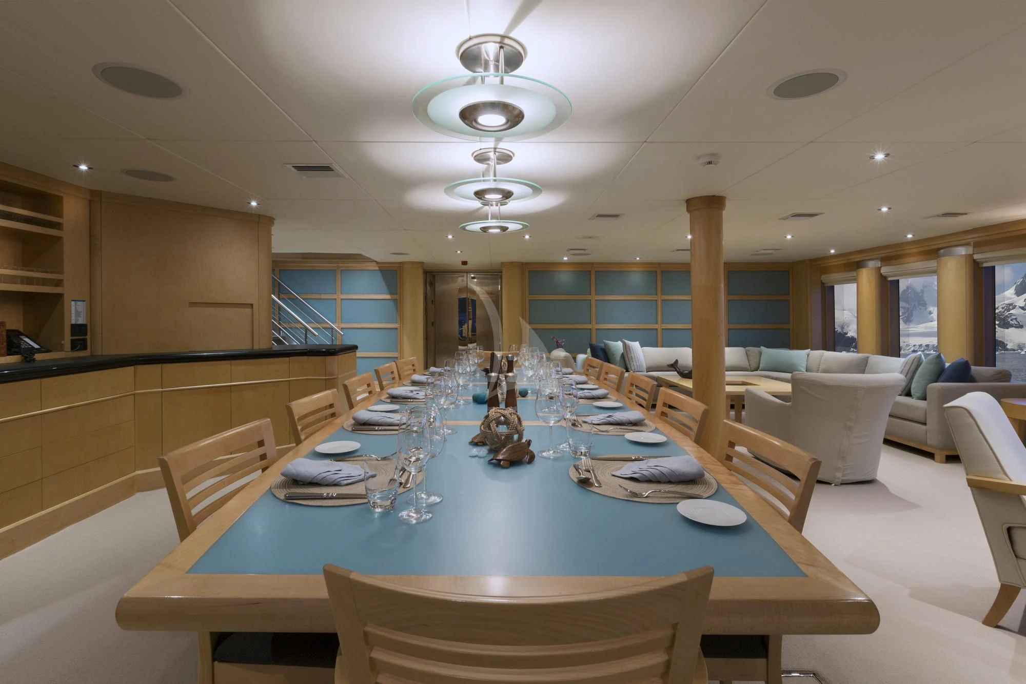 a large dining room with a table set for a meal aboard HYDRA Yacht for Sale