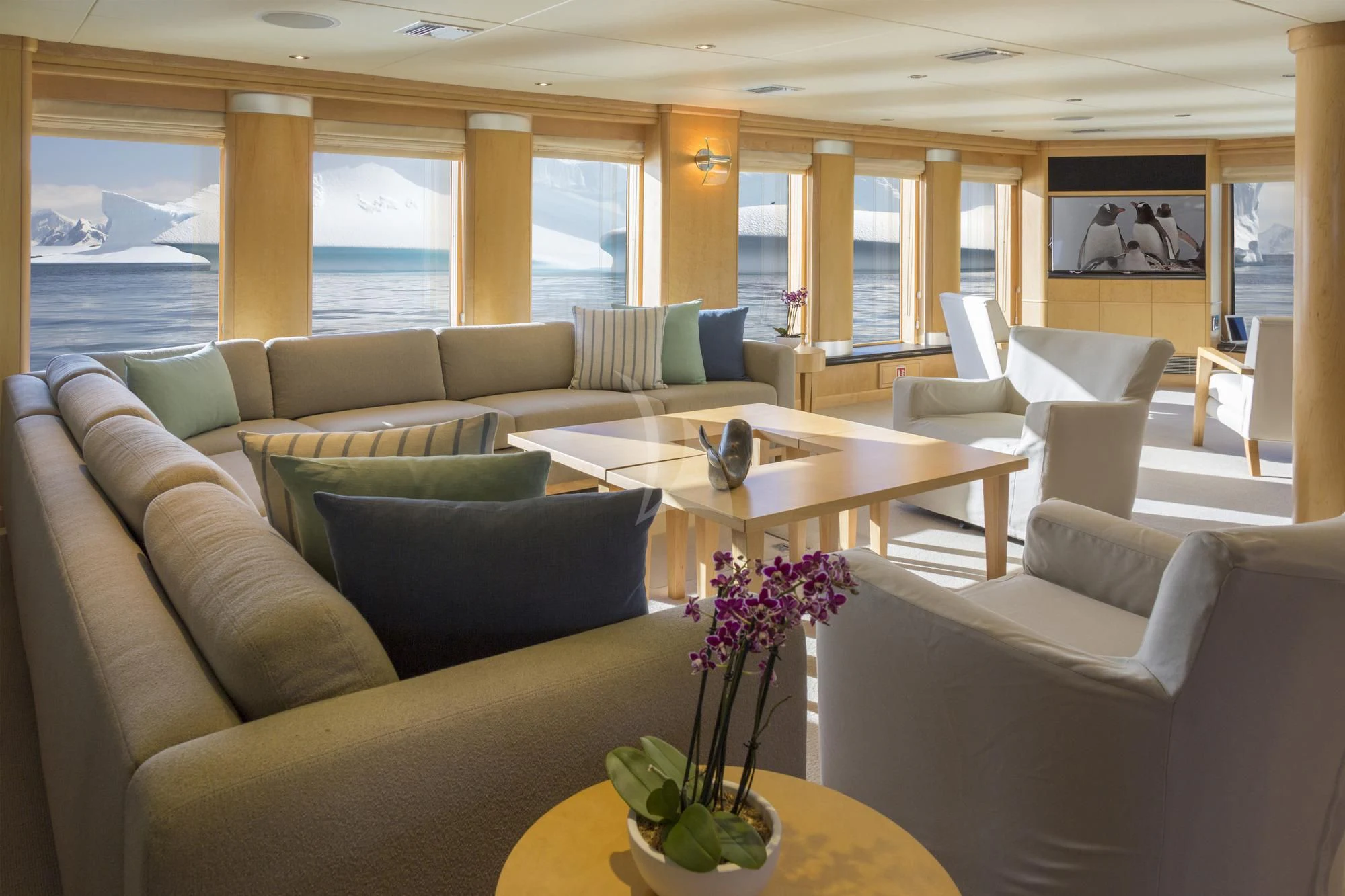 a living room with a large window aboard HYDRA Yacht for Sale