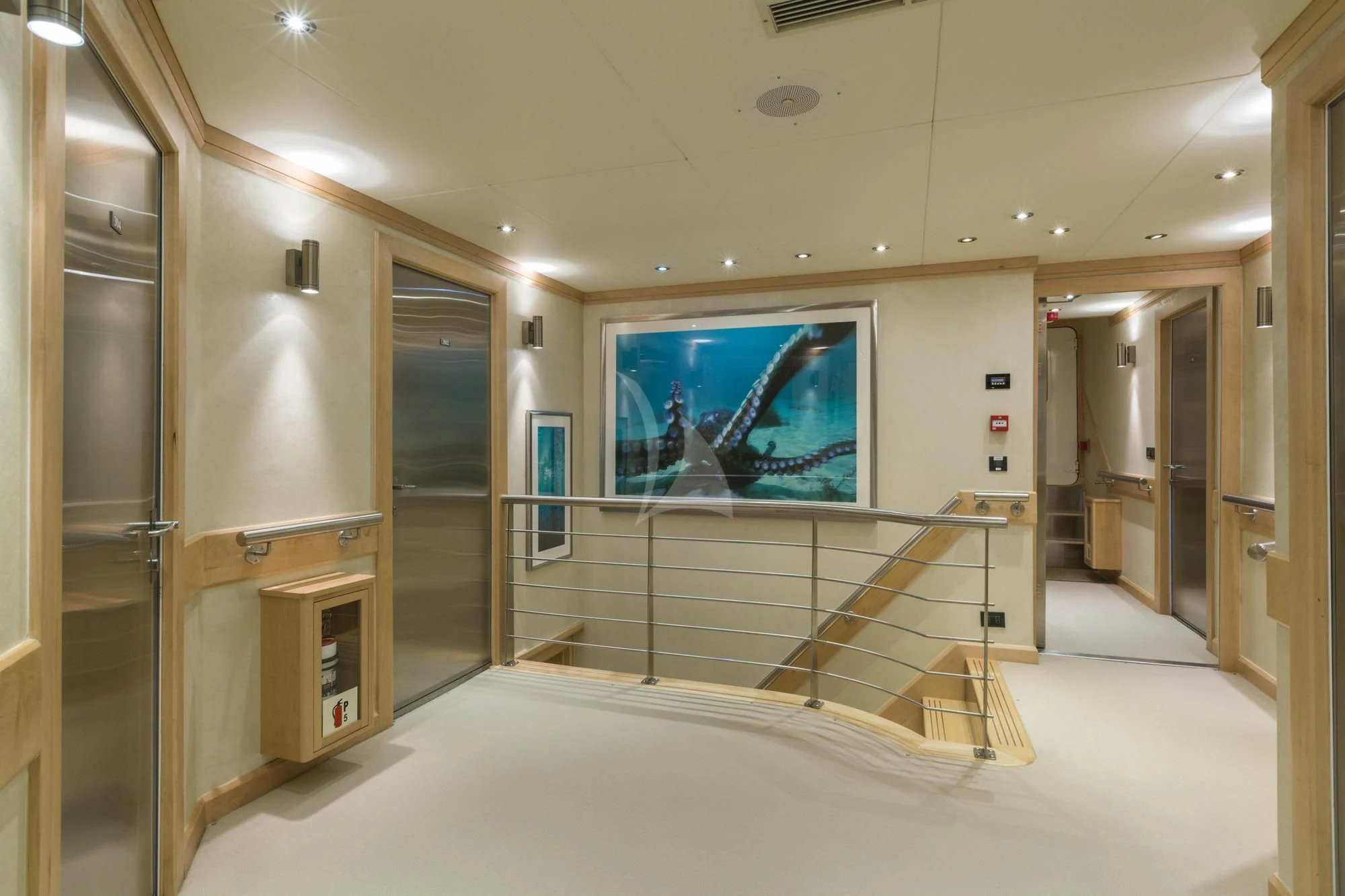 a large bathroom with a large glass shower unit aboard HYDRA Yacht for Sale