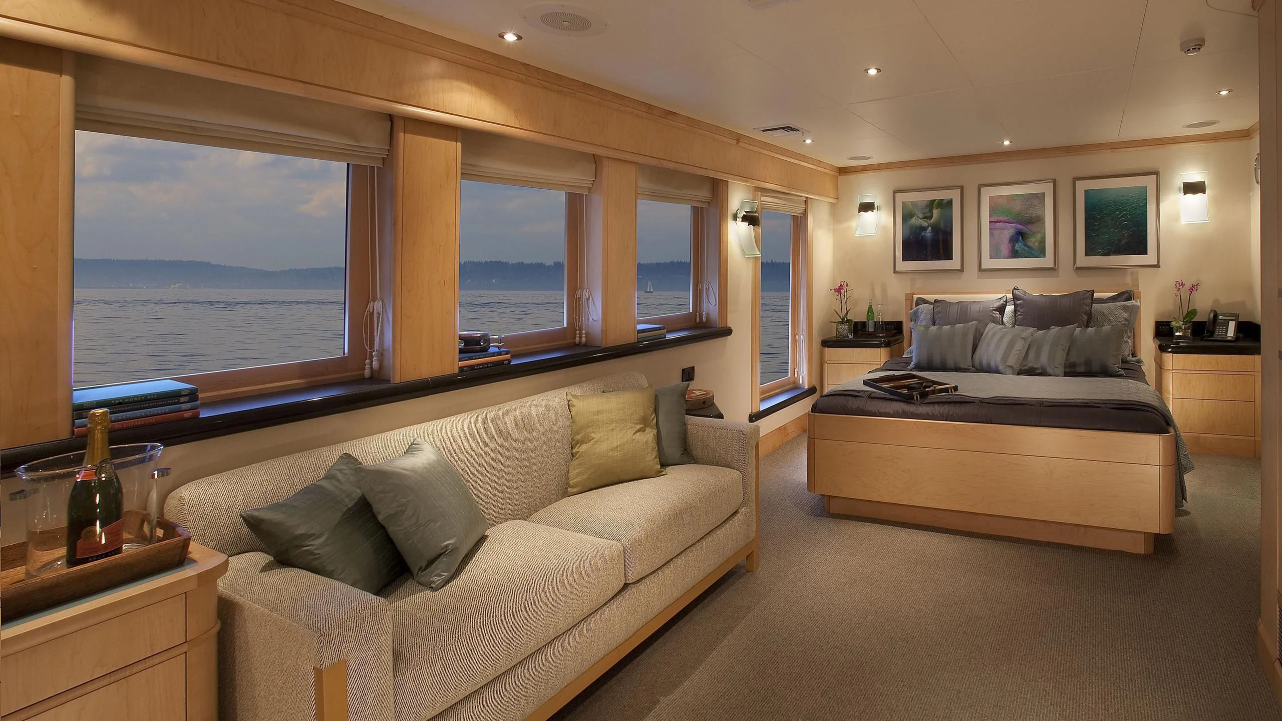 a large living room with a large window aboard HYDRA Yacht for Sale