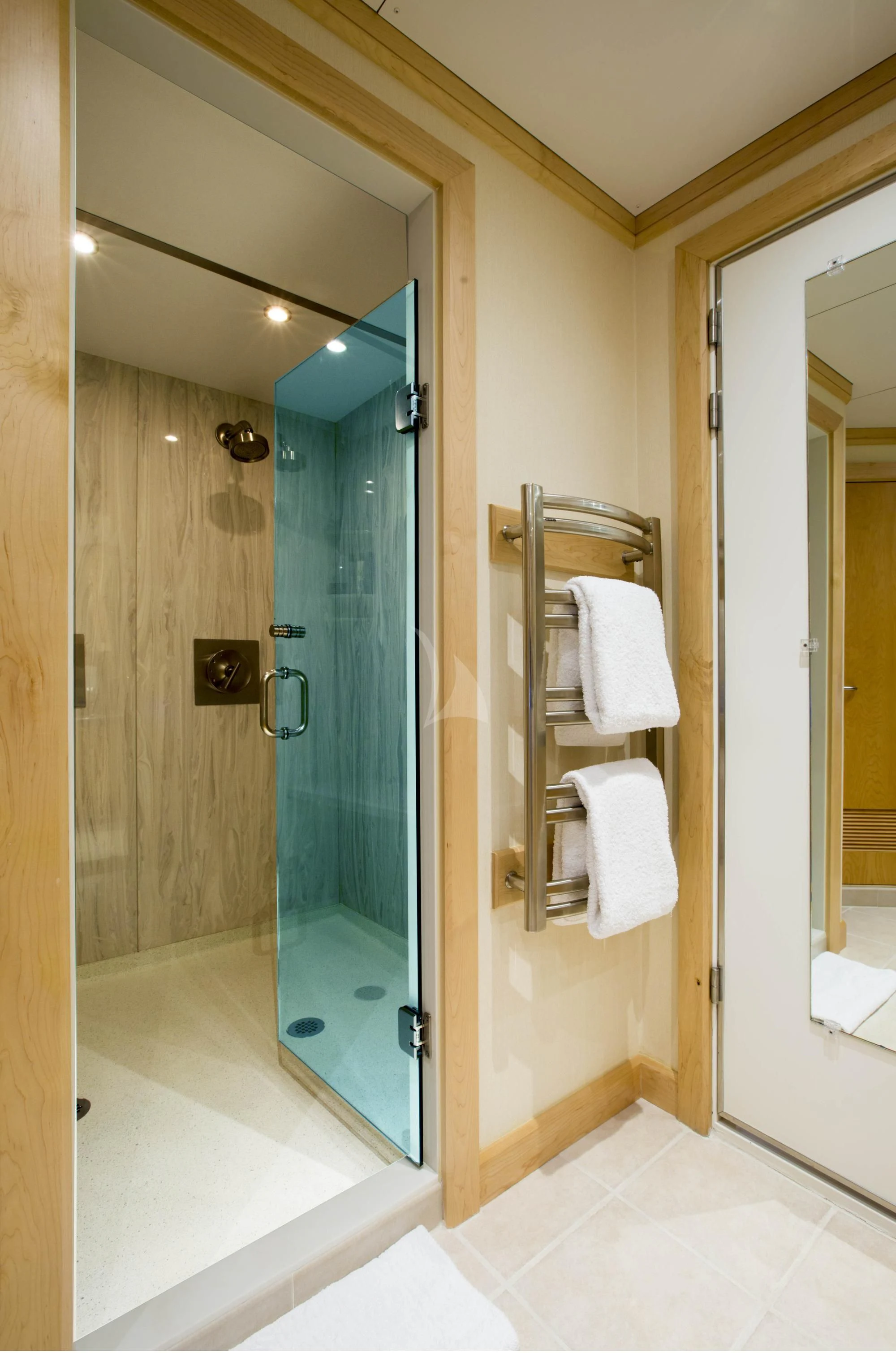 a bathroom with a glass shower aboard HYDRA Yacht for Sale