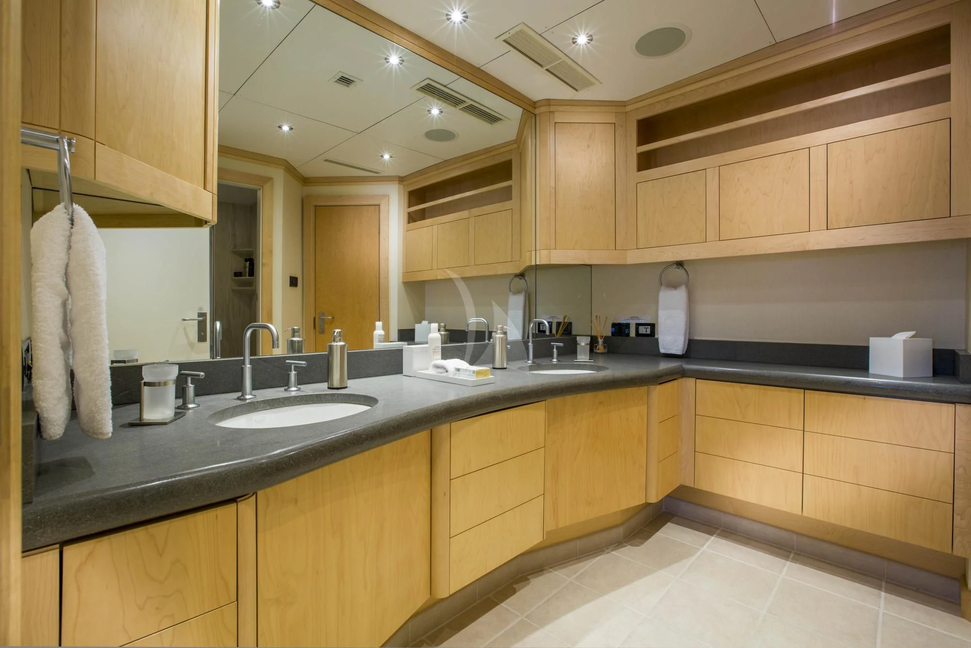 a bathroom with wooden cabinets aboard HYDRA Yacht for Sale
