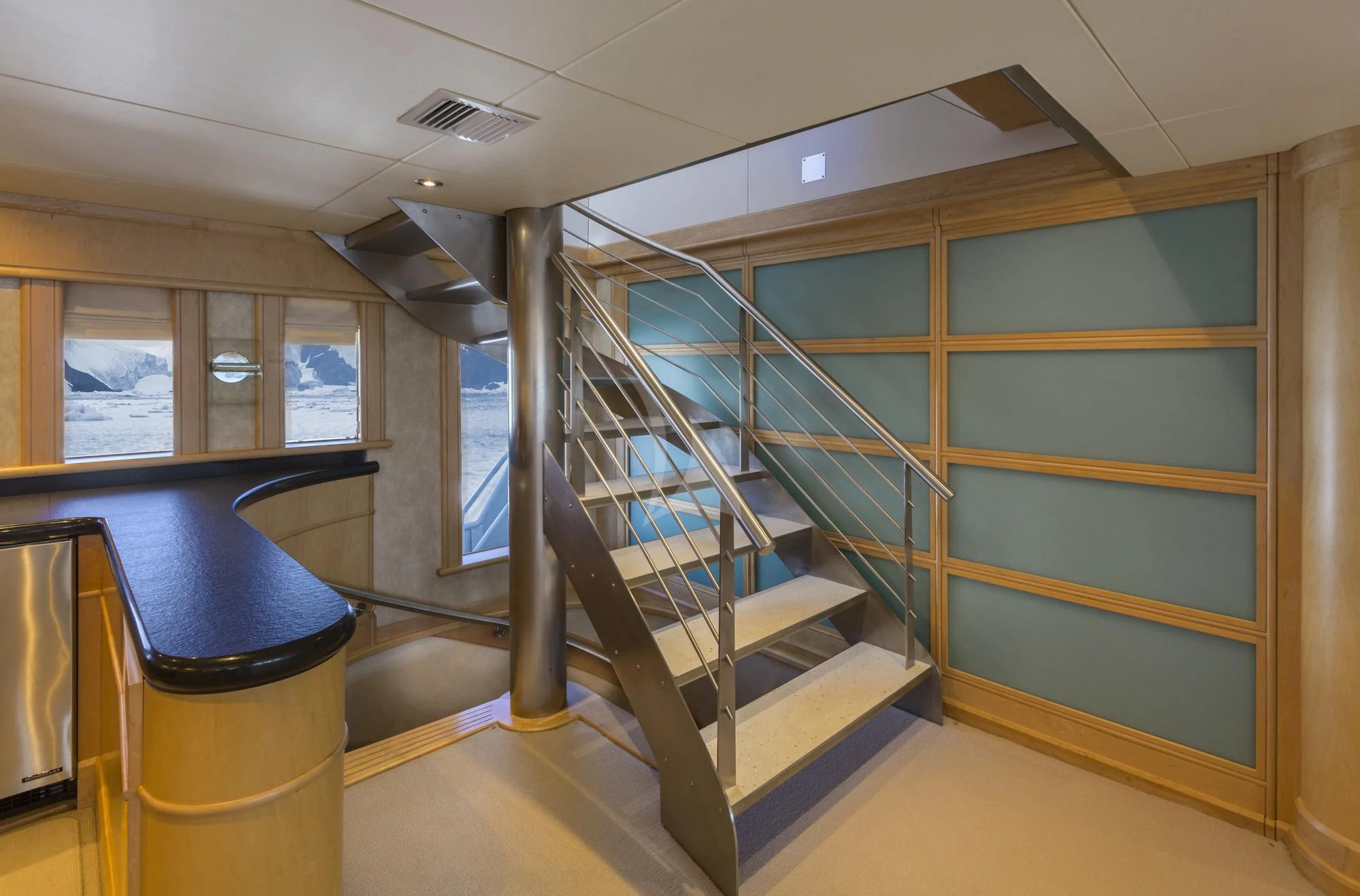 a set of stairs in a building aboard HYDRA Yacht for Sale